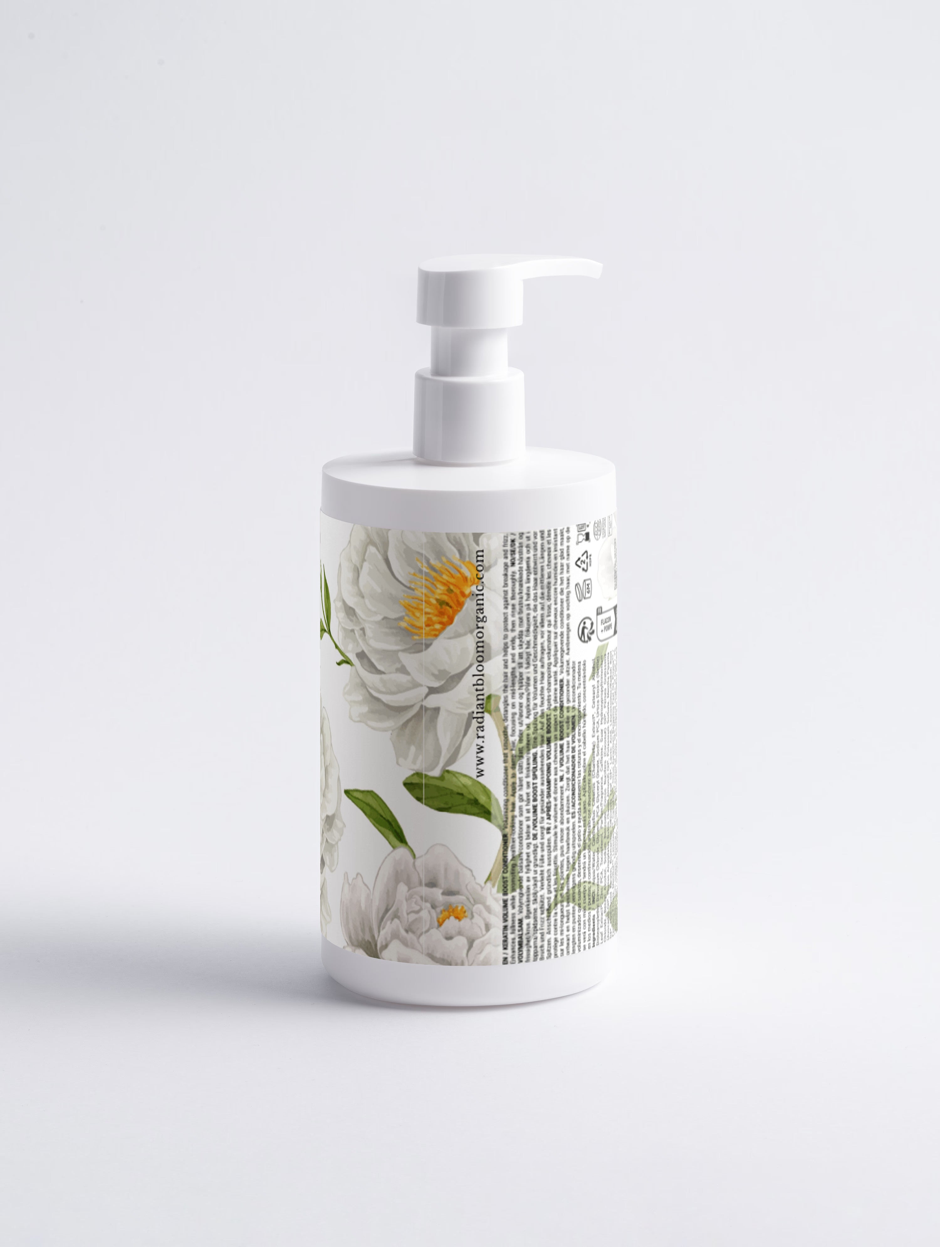 A white pump bottle with a botanical label featuring white flowers, green leaves, and vertical black text, set against a clean white background from Radiant Bloom Organic