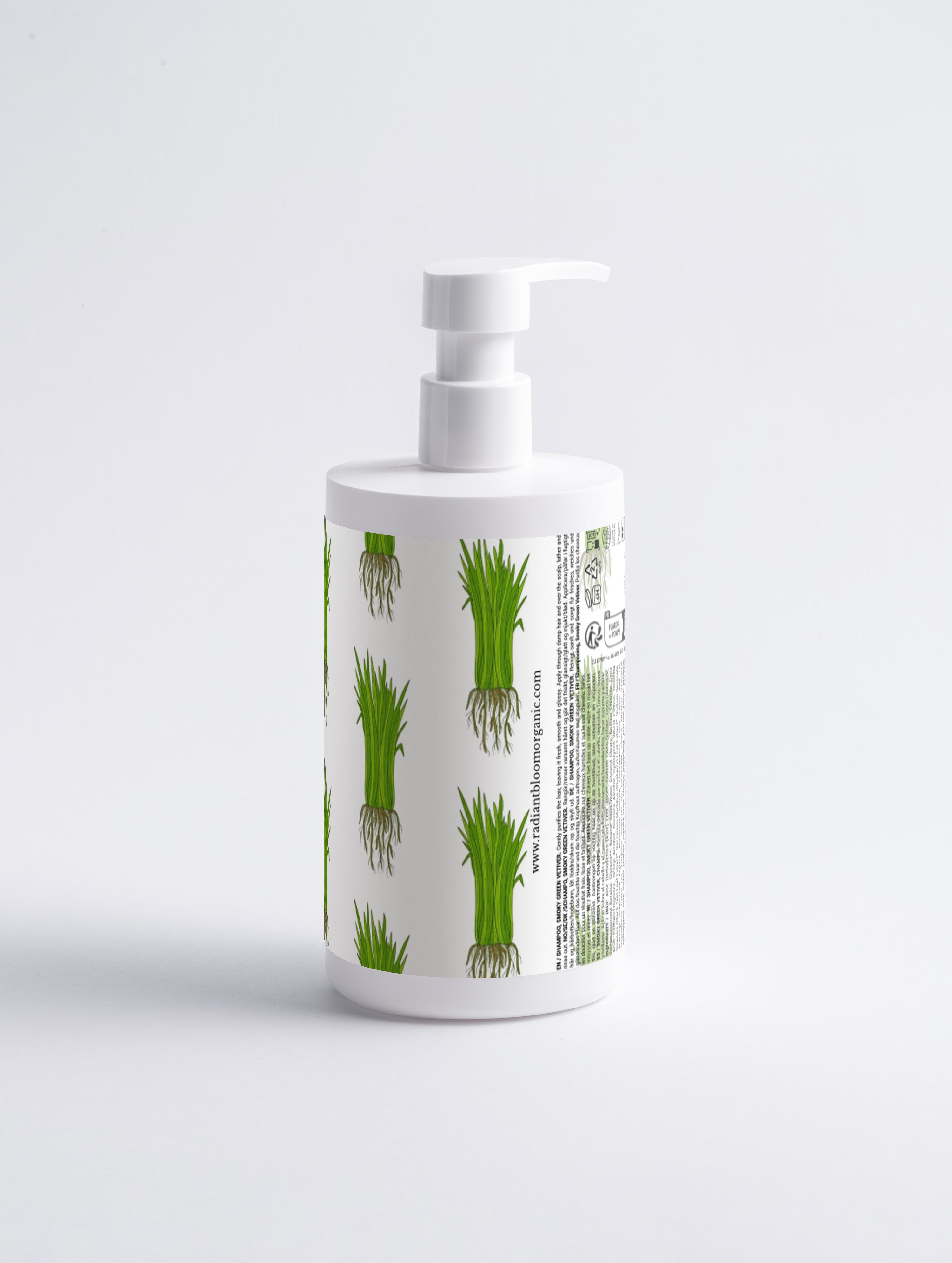 A white pump bottle with a green and white botanical pattern of grass-like plants with roots, shown on a light gray background.