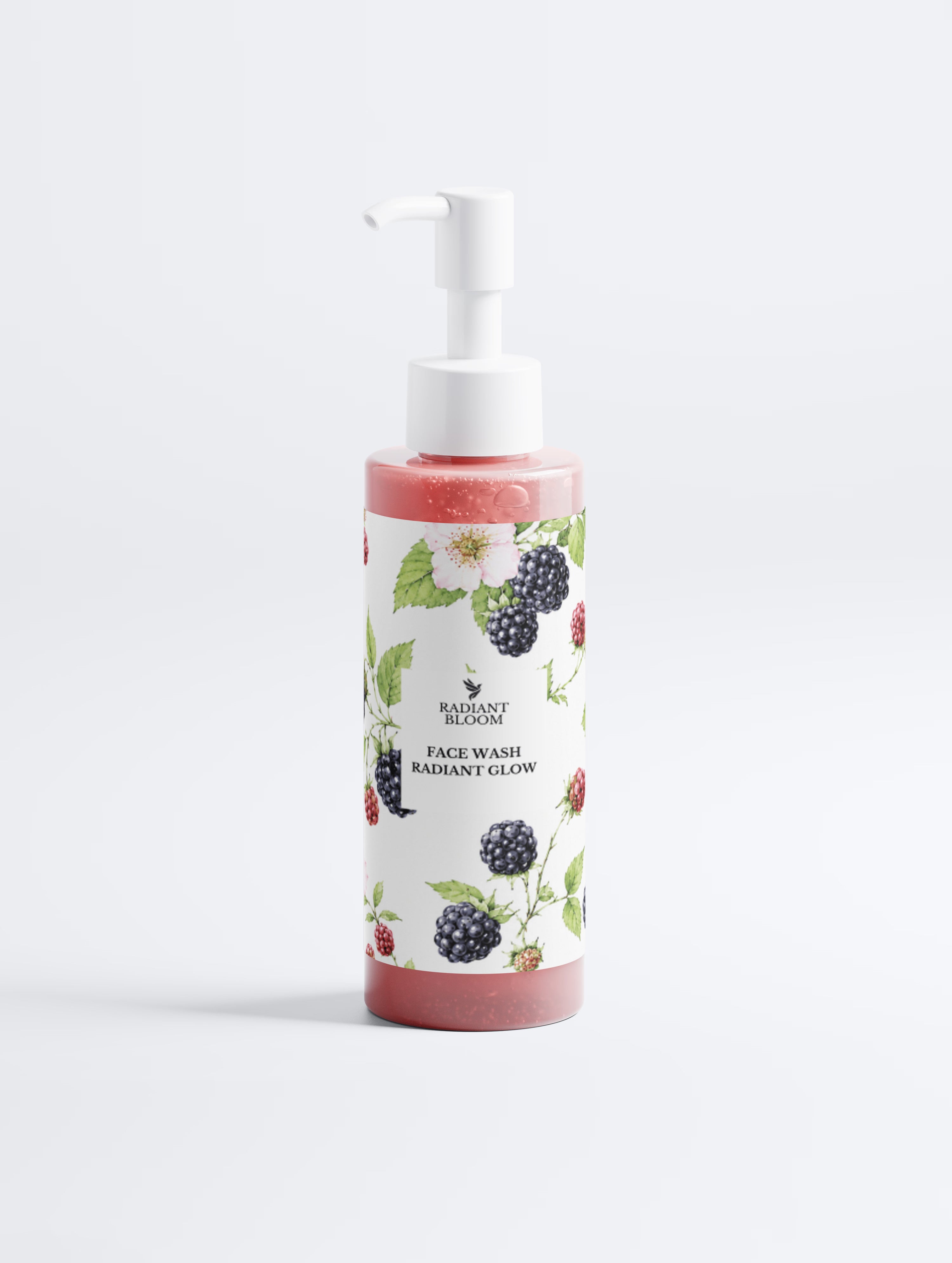 A bottle of Radiant Glow Face Wash by Beautiful Bloom, featuring a white label with blackberry and raspberry illustrations, filled with pinkish-red liquid and topped with a white pump dispenser, set against a clean white background.