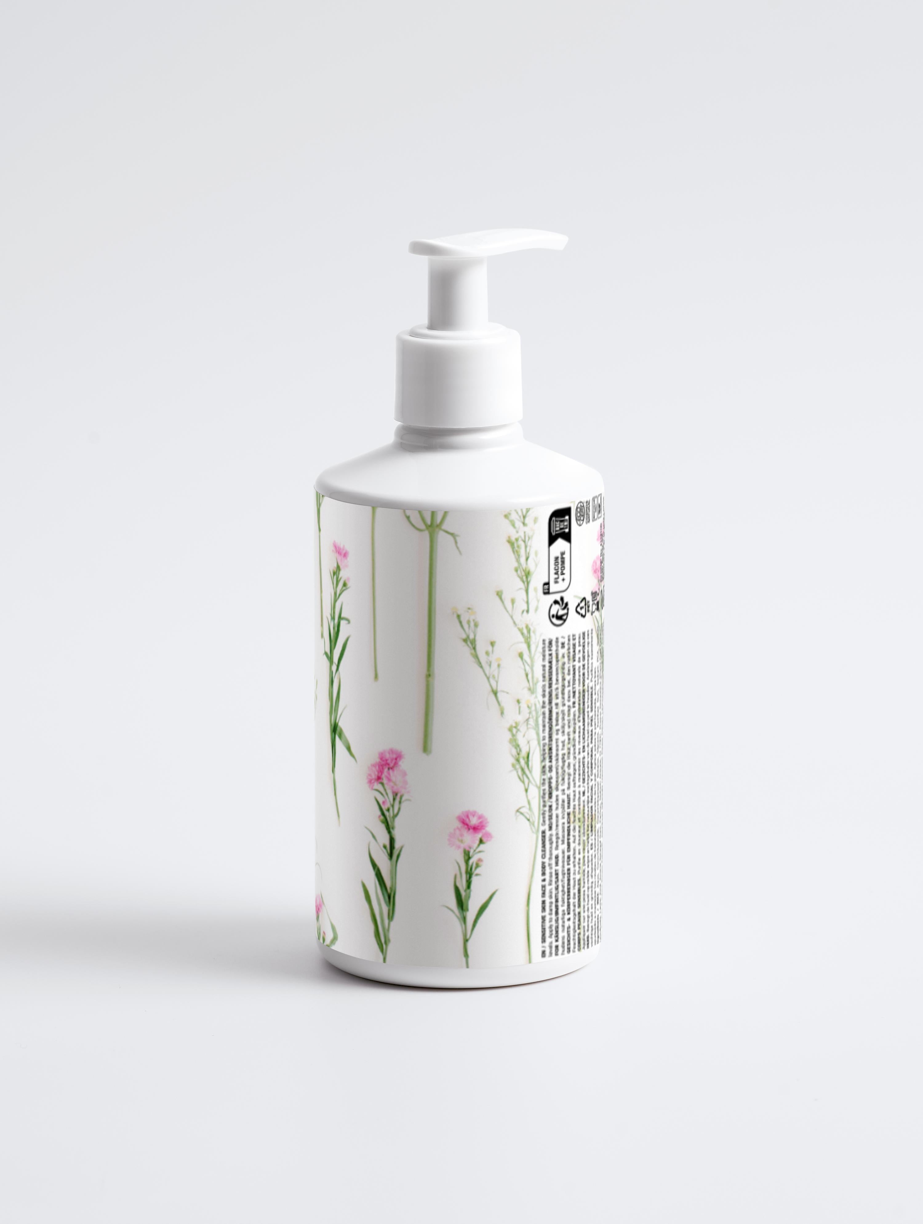 Radiant Bloom cleanser bottle with white pump; back/side label text visible.
